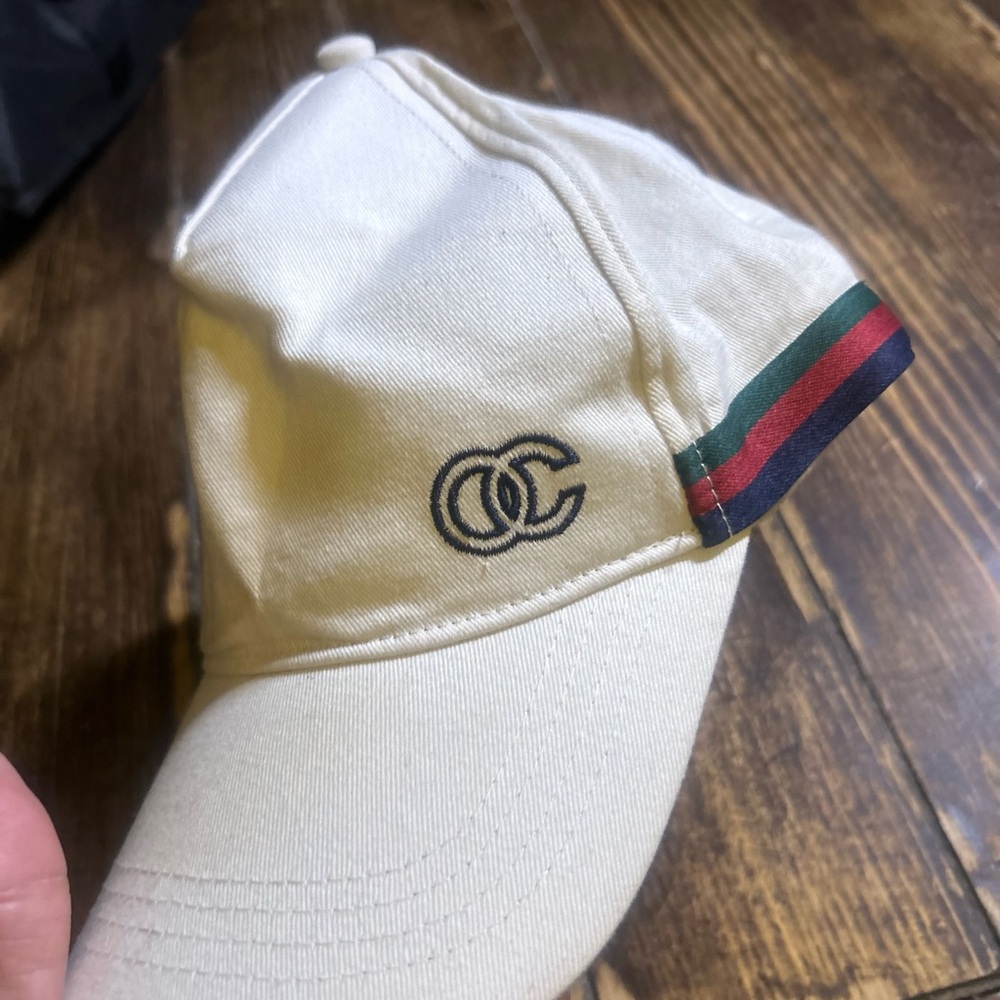 Cream Cap with Logo  channel and Striped Detail